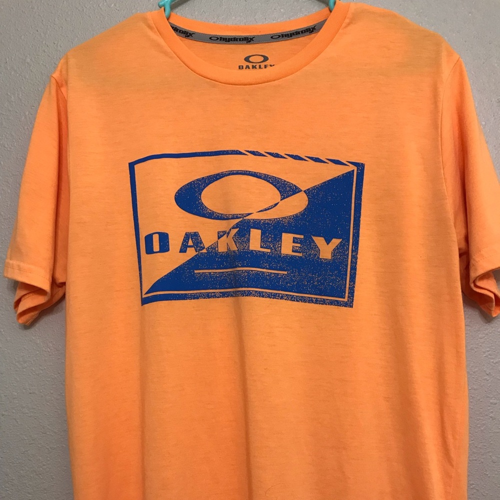 Oakley Tee. Size Medium. orange and Blue.